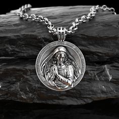 This silver necklace is handmade by Burning Ship Metalworks. It is made from recycled silver. A Renaissance-inspired version of Virgin Mary pendant, cast in .925 sterling silver, and handmade with a lot of love. Cast with a nice bright polished finish that will keep it shiny for a long time to come. The Virgin Mary is making an appearance in churches across the world. An increase in the popularity of this religious icon has set new records for sales, creating a great demand for items such as fig Silver Amulet Medallion Necklace With Charms, Silver Medallion Amulet Necklace With Charms, Silver Polished Medallion Necklace, Symbolic Sterling Silver Pendant Medallion Necklace, Symbolic Stainless Steel Jewelry With Large Pendant, Silver Medallion Pendant Necklace With Polished Finish, Silver Pendant Medallion Necklace With Polished Finish, Silver Medallion Necklace With Polished Finish, Stainless Steel Large Pendant Necklaces