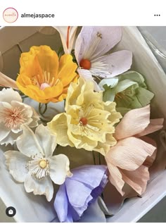 a bunch of flowers that are in a box