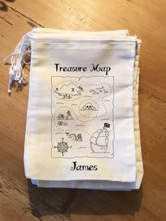 a drawstring bag with the words, treasure map james written in black on it