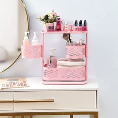 a pink shelf with cosmetics and toiletries on it