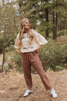 Say goodbye to boring basics with the Summers End Terry Top in Cream. This cute and comfortable top features an oversized fit perfect for comfortable everyday wear. Features a "SUNKISSED 1975 SUMMERS END" graphic. Paired with THE CAROLYN PANT IN BROWN Oversized fit Round neck 74% cotton 26% polyester Runs true to size. Small (0-4), Medium (6-8), Large (10-12). Model is 5'5" wearing a small. To view our return policy, click here! Check out our try on video below! Casual Loose Fit Cotton Tops, Casual Cotton Tops Loose Fit, Casual Cotton Tops With Loose Fit, Casual Loose Fit Tops For Loungewear, Brown Relaxed Fit Sweatshirt For Spring, Casual Soft-washed Tops For Leisure, Spring Casual Brown Sweatshirt, Casual Brown Sweatshirt For Spring, Relaxed Leisure Top For Fall