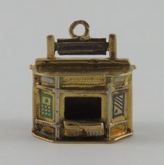 "This is a vintage \"Enamel Storefront Kiosk\" 18 karat gold charm for a charm bracelet.  It weighs 2.75 grams and measures 1/2\" x 5/8\", tested 18K. All charms come with a split ring to attach to a bracelet. We have hundreds of charms in stock. If you don't see what you are looking for in our shop please contact us as it is likely we have it. Inventory #G3629" Theater Stage, Tiny Cross Necklace, Tiny Cross, Gold Bracelets, Great Gifts For Mom, Yellow Gold Bracelet, Small Rings, Split Ring, Kiosk