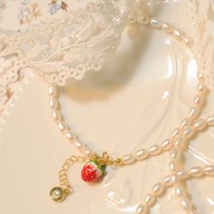 Indulge in the delight of our Strawberry Pearl Bracelet, a harmonious fusion of eternal pearls and charming playfulness. Each radiant pearl is carefully selected and strung together, enhanced by an intricately enameled strawberry charm. Crafted from 18K gold on brass, this whimsical piece exudes luxury and elegance. Embrace the delightful fusion of classic beauty and modern charm, and let this exquisite piece adorn you with its enchanting allure. Details Plating: 18K Gold Materials: 18K Gold on Strawberry Charm, Beach Bracelets, Cool Art Drawings, Jewelry Inspo, Pearl Size, Classic Beauty, Beaded Chain, Gold Material, Pearl Bracelet