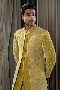 Gold, yellow jodhpuri jacket with thread, zardozi, sequin embroidery in floral pattern. Paired with sherwani and narrow pant. - Aza Fashions Pista Green Nehru Jacket For Designer Wear, Transitional Designer Wear Yellow Sherwani, Yellow Bandhgala With Zari Work For Designer Wear, Designer Yellow Sherwani For Eid, Festive Yellow Designer Bandhgala, Yellow Fitted Bandhgala For Designer Wear, Yellow Designer Sherwani With Traditional Drape, Yellow Sherwani With Traditional Drape, Designer Long Sleeve Yellow Sherwani