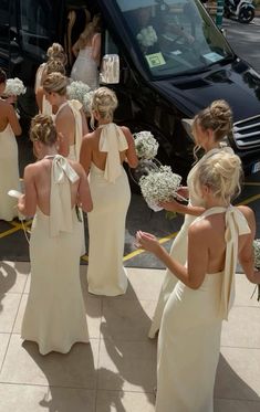 the bridesmaids are getting ready to get into their limo