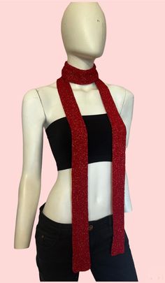 a female mannequin wearing a red scarf