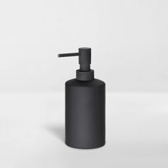 a black soap dispenser on a white background