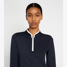 Our Half-Zip Performance Pullover is an essential layering piece on and off the court. Engineered in performance interlock, it is lightweight, moisture wicking and exceptionally breathable — with a flattering fit and stretch for full range of movement. Sporty Half-zip Tops For Layering, Navy Sporty Half-zip Top, Sporty Navy Half-zip Top, Sporty Tops For Golf In Fall, Sporty Golf Tops For Fall, Athleisure Long Sleeve Tops For Golf, Sporty Half-zip Activewear For Layering, Sporty Half-zip Go-dry Tops, Printed Silk Shirt