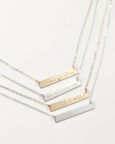 "This bar necklace is a classic, easy to gift piece. From the chain to the pendant, this style is made with 14k gold filled or sterling silver pieces, meaning it is built to last. Personalize this necklace with the names, dates, and special words that mean the most to you! 𝗘𝗮𝘀𝘆 𝗧𝗼 𝗦𝘁𝘆𝗹𝗲, 𝗠𝗮𝗱𝗲 𝗧𝗼 𝗟𝗮𝘀𝘁 Our classic bar necklaces make for the perfect everyday piece, personalized with your most special sentiments, moments, and memories! Created to last a lifetime, these necklaces Silver Bar Necklace Perfect As A Gift, Sterling Silver Bar Necklace For Anniversary, Custom Name Rectangular Jewelry For Wedding, Silver Sterling Bar Necklace For Anniversary, Elegant Personalized Silver Bar Necklace, Classic Silver Bar Necklace For Anniversary, Silver Rectangular Bar Necklace With Custom Name, Elegant Silver Nameplate Bar Necklace, Minimalist Gold Engraved Bar Necklace