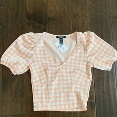 Adorable Pink Gingham Top With Puff Sleeves. Nwt. The Top Is A Size S, But Definitely Fits More Like A Xs. Top Is Cropped Length, But As You Can See In Pics If Work With High Waisted Bottoms It Doesn’t Look As Cropped. Spring Plaid Puff Sleeve Top, Plaid Puff Sleeve Top For Spring, Summer Plaid Puff Sleeve Tops, Plaid Puff Sleeve Tops For Summer, Trendy Fitted Gingham Top, Fitted Gingham Top Trendy Style, Casual Fitted Gingham Tops, Fitted Gingham Tops For Day Out, Gingham Fitted Top For Fall