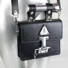 Industrial design Goth Steampunk black leather shoulder bag, evening bag, satchel with torch as a handle.Has removable shoulder strap with shoulder pad, and the torch can be used as the handle.True piece of art and conversation starterBag is vintage, material is genuine leather from ItalyPerforated stainless steel logoTorch as a handleThe torch works.2 x batteries of AAA are required, batteries are not included as the we cannot send these batteries overseasWidth of the bag is 20.50 cm or 8.125 i Futuristic Purse, Goth Industrial, Goth Purse, Unusual Handbags, Goth Steampunk, Industrial Steampunk, Statement Art, Black Leather Crossbody Bag, Evening Handbag