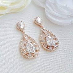 Cubic Zirconia Bridal Drop Earrings for a Sparkly Wedding Day Look If you’re looking for a pair of bridal earrings that will make you shine on your wedding day, you’ll love the Cubic Zirconia Bridal Drop Earrings. These bridal drop earrings are designed to be unique and feature a teardrop shape that sparkles in the light. The craftsmanship is superb, with a bride or woman-like design inside the drop that makes it stand out and unique from all the others. The Cubic Zirconia Bridal Drop Earrings a Bridal Pendant Necklace, Rose Gold Bridal Jewelry, Gold Costume Jewelry, Teardrop Bridal Earrings, Bridal Pendant, Sparkly Wedding, Bracelet Tennis, Costume Jewelry Sets, Bridal Earrings Drop