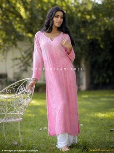 "Peach Maisha Modal Straight Chikankari Kurti Lucknawi Chikan Hand Embroidered Kurta Fabric : Modal Sleeves : 3/4 Sleeves Style : Straight Kurti Length : 44-46 Inches Occasions : Casual Wear, Office Wear, Festive Wear Garment Care : Hand Wash Only Net Content : Only Kurti Disclaimer : : Motifs of embroidery may vary as the images shown are for illustration purpose. <> \"Crafting Culture\" as our Tagline says by the nature of how our designs are made, we are striding delicately and leisurely on the planet, as everything from our pattern cutting to block-printing to embroidery and washing is done by human hand in small batches. The small-scale, handmade production allows for centuries-old techniques to be viable and sustainable for our artisans, as we are not demanding they make 1000+ units Long Embroidered Pink Salwar Kameez, Long Embroidered Pink Kurta, Long Pink Embroidered Kurta, Long Pink Kurta With Zari Work, Traditional Long Pink Kurta, Long Pink Salwar Kameez With Dabka Embroidery, Pink Long Sleeve Salwar Kameez With Chikankari Embroidery, Pink Long Salwar Kameez With Dabka Details, Pink Long Salwar Kameez With Dabka