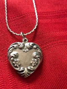 "Antique/Vintage Sterling Silver Heart Pendant with Chain Marked Holland 925 on the Heart and Sterling on the Chain. Signed 925 Sterling Silver Floral Heart Pendant. the beautiful flowered pendant measures 3/4\" wide x just over 3/4\" in length. The pendant is vintage/antique but the chain may be newer, marked STERLING on the clasp. The chain is a beautiful 24\" long with a wonderful link pattern. A very special necklace for a special person who appreciates vintage and antique silver. This was i Collectible Heirloom Necklace For Valentine's Day, Classic Heart-shaped Collectible Jewelry, Classic Heart Jewelry For Collectibles, Classic Heart Shaped Collectible Jewelry, Vintage Heart Pendant Necklace For Anniversary, Heart Pendant Necklace With Vintage Charm For Anniversary, Anniversary Heart Pendant Necklace With Vintage Charm, Vintage Open Heart Jewelry With Heart Charm, Vintage Open Heart Jewelry With Charm