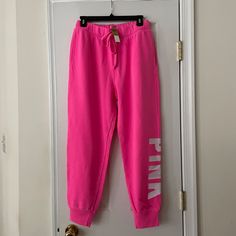 *Victoria's Secret Pink Fleece Joggers *New With Tags *Size: Medium *Color: Hot Pink *"Pink" Logo On Left Leg. *Adjustable Drawstring At Elastic Waistband. *Rib Cuff At Leg Opening. *Inseam: Approx. 27" *Relaxed Fit. *Victoria's Secret Sizing. Not Responsible For Actual Fit. Pink Joggers For Fall Loungewear, Pink Fall Joggers For Loungewear, Pink Joggers For Winter Loungewear, Pink Winter Joggers For Loungewear, Pink Stretch Sweatpants For Winter, Pink Fitted Joggers For Loungewear, Fitted Pink Joggers For Loungewear, Sporty Loungewear Bottoms From Victoria's Secret, Victoria's Secret Pink Casual Pants