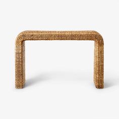 a small table made out of wicker with a long wooden frame on the top