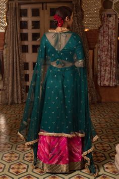 Teal, pink lehenga with patchwork embroidery and gota border. Paired with padded blouse and mukaish embroidered dupatta.
Component: 3
Pattern: Embroidery
Type Of Work: Mukaish, gota
Neckline: V neck
Sleeve Type: Half
Fabric: Chanderi Silk ,Silk, Brocade, Satin, Cotton, Chikankari , Tissue
Color: Green,Pink
Other Details: 
Weight (in kg): 3
Side and back tassel tie-up
Fringe bordered sheer dupatta
Occasion: Destination Wedding - Aza Fashions Pink Kundan Sets With Sheer Dupatta, Pink Banarasi Silk Sharara For Reception, Pink Banarasi Silk Bollywood Sharara, Pink Dola Silk Choli With Sheer Dupatta, Pink Choli With Sheer Dupatta In Dola Silk, Designer Pink Banarasi Silk Lehenga, Designer Pink Banarasi Silk Sharara, Pink Banarasi Silk Dress With Dupatta, Banarasi Silk Sharara With Gota Work For Reception