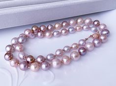 Handmade item: Size: 55 cm Materials: Genuine Round Shape Edison Pearl With Iridescent Color Rare Mauve Pink Golden 13-14 x 11 mm Genuine Freshwater Pearl Size : 9 mm-10 mm Color: pink-lavender Sterling Sliver Frosted Bead Safety Clasp 925 sterling silver rose gold plated NOTE: Gemstones color and inclusions may vary slightly from the picture, due to different monitor setting Formal Pink High Luster Necklace, Iridescent Color, Edison Pearls, Pearls Necklace, Pink Lavender, Freshwater Pearl Necklace, Mauve Pink, Wedding Jewellery Necklace, Freshwater Pearl Necklaces