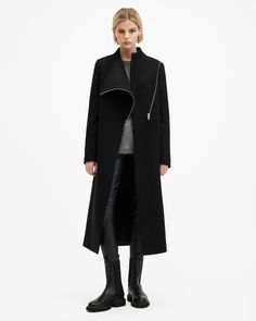 A coat that never fails. This is the Margoh. Made from a recycled wool-blend fabric to a statement asymmetric silhouette that takes its inspiration from our archive designs – they're timeless. Complete with a grown-on neckline and multiple pockets, it's our coat of the season.   This coat is designed to a regular fit that fits true to size Zip closure Long sleeves Midi length Grown on neckline Asymmetric wrap front Two pockets One interior pocket Recycled fabrics The Archive Collection is a cura Allsaints Black Outerwear For Work, Modern Asymmetrical Zip Outerwear For Work, Chic Asymmetrical Outerwear For Business, Chic Asymmetrical Business Outerwear, Modern Asymmetrical Zip Outerwear For Fall, Modern Outerwear With Asymmetrical Zip For Fall, Modern Fall Outerwear With Asymmetrical Zip, Modern Asymmetrical Outerwear For Work, Modern Asymmetrical Outerwear For Fall