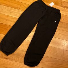 Womens Nike Loose Fit Sweatpants. Black Large New With Tags Black Athleisure Bottoms For Work, Nike Black Sweatpants For Workout, Nike Black Bottoms With Pockets, Nike Black Cotton Bottoms, Nike Black Sweatpants With Elastic Waistband, Nike Black Activewear Long Pants, Nike Black Relaxed Fit Pants, Nike Black Sweat Pants, Nike Relaxed Fit Full-length Sweatpants