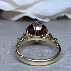 "The ring pictured is lab created ruby #6214 Shown in 14k yellow gold and 14k white gold **Ruby is birthstone of July** -Approximate total carat weight: 3.26ctw. diamond equivalent approx. -Center Stone Size: 9x9mm - approx. 3.20ct. diamond equivalent approx. -Gem Type: Lab created red ruby -Center Stone Shape: asscher cut -Center Stone Color: red -Center Stone Clarity: AAA -Moh's Scale: 9 Hardness -Accent Stones: natural diamonds -Accent Stone Weight: 0.06ctw. Approx. -Accent Stone Color: G -Ac Yellow Gold Birthstone Ring With Round-cut Lab-created Ruby, Yellow Gold Birthstone Ring With Round Cut Lab-created Ruby, Yellow Gold Birthstone Ring With Lab-created Ruby, Yellow Gold Lab-created Ruby Birthstone Ring, Promise Ruby Ring With 14k Gold Center Stone, Yellow Gold Ruby Ring With Round Cut Lab-created Ruby, Gold Ruby Ring With Center Stone And Round Band, Gold Ruby Ring With Center Stone In Round Band, Yellow Gold Ring With Lab-created Ruby In Halo Setting