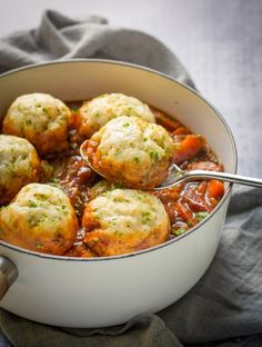 a pot filled with meatballs and tomato sauce