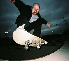 a man riding a skateboard up the side of a ramp at night with dark clouds in the background