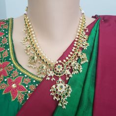 "Handmade Indian Jewelry item * Stunning Hand made traditional jewelry set. * Necklace Set is a combo of Necklace & Stud Earrings * Necklace is adjustable with adjustable back chain/ Dori/ Cord * Necklace Length: 10\", Necklace Weight: 3.75 Oz/ 105 Gm * Each Earring Weighs: 0.20 Oz/ 5 Gm, Earring Length: 1.5\", Earring Width: 0.5\" * Packed in a box, Ideal For GiftingOn Request, We Can Add A Custom Message For Your Loved One (At No Additional Cost) :) Color, shades, texture displayed may sli Green Kundan Necklace For Navratri Temple Jewelry, Temple Jewelry Sets With Cutdana For Celebrations, Festive Traditional Jewelry Sets With Peacock Design, Temple Jewelry Traditional Wear With Stone Work For Navratri, Green Bollywood Temple Necklace For Puja, Bollywood Style Green Temple Necklace For Puja, Green Bollywood Style Temple Necklace For Puja, Elegant Chandbali Jewelry For Traditional Ceremonies, Green Temple Necklace For Diwali Puja