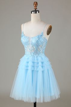 Discover the effortlessly chic and flirty charm of our Light Blue Sheer Bodice Ruffle Tiered Short Homecoming Dress. The lace adorned sheer bodice highlights your figure while the A-line ruffle tiered skirt adds a touch of playfulness. With a scoop neck and delicate spaghetti straps, this dress is perfect for any homecoming event.#shortdress #cocktail #semiformal #cocktaildress #homecoming #homecomingdress #semi #shortdresses Lace Dress With Ruffle Hem And Sweetheart Neckline, Lace Ruffle Dress For Prom Season, Tiered Ruffle Dress For Homecoming, Blue Wedding Dress With Ruffle Hem, Light Blue Sweetheart Neckline Dress With Ruffles, Blue Tiered Tulle Dress, Blue Tulle Dresses With Ruffled Skirt, Blue Tulle Dress With Lace Trim, Light Blue Ruffled Dresses For Prom