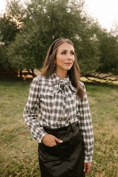 Black and white plaid woven fabric Collared neckline with functional detachable bow Long fitted sleeve with cuff at wrist Button up style with functional buttons Nursing friendly Unlined Non-stretch fabric matching mommy & me style + for the whole family flowy floral dresses, earthy tones, vintage-inspired layers, cottagecore accessories, soft autumn hues, cottagecore dress, fall dress, fall fashion, family photo, modest fashion Casual Fall Blouse With Bow Detail, Casual Fall Blouse With Bow, Long Sleeve Tops With Bow Tie For Fall, Bow Top For Office Wear, Spring Long Sleeve Top With Bow Tie, Classic Workwear Tops With Bow Detail, Classic Workwear Tops With Bow, Classic Tops With Bow For Work, Classic Bow Tops For Workwear