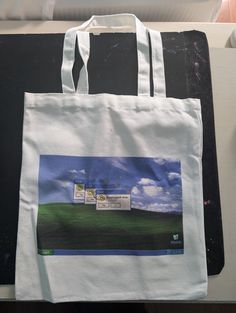 Windows XP Wallpaper Tote Bag- 28 by 35 cm. The design on the bag features an error message that says "be kind to yourself" with the no option greyed out. Xx Wallpaper, Webcore 2000s, Windows Xp Wallpaper, Frutiger Aero, Error Message, Windows Xp, Be Kind To Yourself, Beauty Book, Accessory Gift