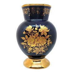 a blue vase with gold floral designs on the front and sides is shown against a white background