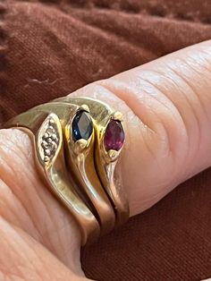 VERY VERY good condition.    10k solid Yellow Gold Hallmark 2  Diamond: Clarity SI Color    H Natural Blue Sapphire Natural Red Ruby Weight: 6.2 Ring size 6.5 Collectible 14k Gold Multi-stone Rings, Collectible Multi-stone 14k Gold Rings, Yellow Gold Marquise Cut Collectible Ring, Anniversary Snake Ring With Gemstone, Anniversary Gemstone Snake Ring, Fine Jewelry Anniversary Snake Ring In Oval Shape, Oval Snake Ring For Anniversary, Fine Jewelry, Oval Snake Ring For Anniversary In Fine Jewelry, Fine Jewelry Birthstone Rings For Collectibles