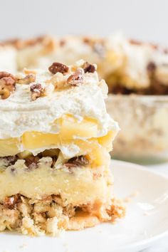 a close up of a piece of cake on a plate with another slice in the background