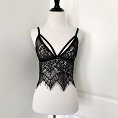 Black Strappy Eyelash Lace Bralette Brand New, Never Used But Cut Off The Tags And Labels Size Fits A Small/ 32a Or B Similar To For Love & Lemons Black Camisole With Delicate Straps For Parties, Black Lace Camisole For Night Out, Party Black Camisole With Delicate Straps, Black Lace Bra-friendly Camisole, Black Low-cut Lace Bra, Black Underwire Camisole For Party, Black Strappy Bra For Night Out, Lace Camisole Bra For Night Out, Black Lace Tops With Delicate Straps