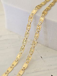 Beautiful solid 14k yellow gold Valentino Star Diamond Cut chain. Perfect for everyday and every occasion. Elegant, unique and everlasting. This Chain will make the Perfect gift. 14k gold will not tarnish or rust. Unisex.  Materials: 14k solid yellow gold. Length: Available in 16 to 24 Inches. Thickness: 2.1mm. Weight: 16''= 2 grams - 18''= 2.2 grams - 20''= 2.3 grams - 22''=2.6 grams - 24''= 2.8 grams. (May vary)  Brand New. 14k gold stamped. The chains in the video are 16", 18," and 20" Inches :) Briza Collections is a small family owned business that works hard on providing the best selection of Fine Solid Gold Jewelry for the best prices.  Our Goal is to bring you happiness and satisfaction, for this reason if you are not satisfied with your purchase we will accept Refunds and exchange Gold-plated Chain Necklace Stamped 14k, Diamond Cut Link Chain Necklace As Gift, 14k Gold Link Chain Necklace, 14k Gold Hallmarked Link Chain Necklace, Gold Oval Link Jewelry With Diamond Cut, 14k Gold Oval Link Necklace With Stamp, Yellow Gold Link Jewelry Stamped 14k, Gold Link Necklaces Stamped 14k, Gold Link Necklace Stamped 14k