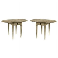 a pair of tables sitting next to each other