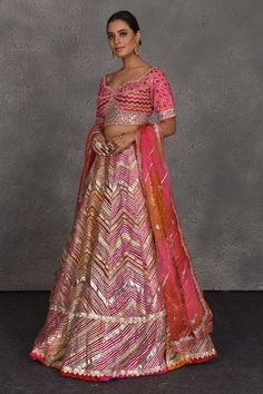 Be the center of attraction at weddings in this one of a kind pink heavy gota lace work designer lehenga. It comes with a matching dupatta. Pink Anarkali Choli With Cutdana, Designer Pink Lehenga With Cutdana Detail, Designer Pink Lehenga With Cutdana, Pink Anarkali Set With Gota Work For Reception, Pink Sharara With Dori Work For Reception, Festive Pink Lehenga With Cutdana Detail, Festive Pink Lehenga With Cutdana, Festive Pink Cutdana Lehenga, Semi-stitched Pink Lehenga With Cutdana