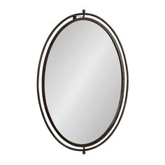 a round mirror with an iron frame around it