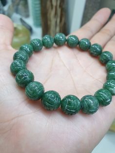 19 pieces of Type A, natural Jadeite beads (non-bleached, non-dyed, non-treated materials), of deep green color, each with detailed carving of Chinese swirls representing Good Fortune. Bead size 10.5 mm. Bracelet size 16 cm, weighs 36 grams (more or less); my be upsized (to 18 cm) or downsized upon request. To request change of size, just send us a direct message after payment; any bead/s taken out will be included in shipping. If no upsizing requested, 2 extra pieces of Jade beads will be included in the shipping; extra sets of elastric strings and an open wire (string guide) included as well. Price posted for 1 piece bracelet only. Cheap Green Novelty Bracelets, Jade Dragon, Jade Ring, White Jade, Dragon Pendant, Jade Bracelet, Jade Beads, Good Fortune, Braided Bracelets