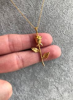 "Gorgeous Rose Necklace! You choose a 16\" or 18\" delicate yet sturdy 14k gold filled chain that holds a detailed rose pendant. (Length pictured is 18\"). On trend, it's my new favorite piece I haven't taken off! Charm measures roughly 17 mm x 40 mm and is 24k gold filled over copper. Excellent detail in this tiny piece! Arrives in a gift box! *if you need an item sooner, please message me! I am happy to ship sooner if I'm able to ❤️" Belle Necklace, Rose Stem, Rose Pendant, Rose Necklace, Floral Necklace, Gold Filled Chain, Necklace Gold, Necklace Etsy, Cross Necklace