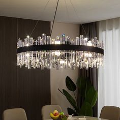 a chandelier hanging over a dining room table