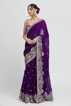 Purple wrap lehenga saree with gold thread, gota embroidery in floral pattern on border. Paired with sleeveless embroidered padded blouse. - Aza Fashions Purple Pre-draped Saree For Wedding, Purple Silk Pre-draped Saree For Wedding, Purple Chanderi Pre-draped Saree For Wedding, Purple Pre-draped Saree With Dori Work, Purple Chanderi Pre-draped Saree For Reception, Sleeveless Georgette Traditional Wear For Wedding, Pre-draped Saree With Cutdana For Reception And Diwali, Purple Pre-draped Saree With Zari Work For Reception, Floor-length Pre-draped Saree With Gota Work For Diwali