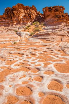 some rocks and sand in the desert