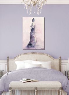 a bedroom with purple walls and a white bed in the center, along with a chandelier