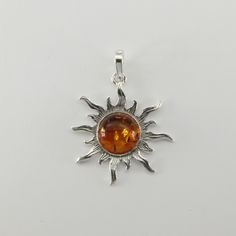 These is a beautiful Sterling Silver Pendant with Amber. The pendant is made out of solid 925 Silver and there is no nickel or other substances causing most allergies. This makes the pendant hypo allergenic. Size of the Pendant in total - with the bail 4.1 x 3.0 cm or  1.61 x 1.18 inch You will receive the item in a gift box - perfect to surprise someone or yourself. Usually we ship on the same day we receive the payment for the order. We want you to be happy with your purchase. If you do not li Silver Baltic Amber Necklace With Polished Finish, Silver Baltic Amber Jewelry As Gift, Silver Baltic Amber Jewelry For Gift, Amber Sterling Silver Round Pendant Jewelry, Amber Polished Sterling Silver Jewelry, Amber Sterling Silver Jewelry With Polished Finish, Lapis Jewelry, Sun Pendant, Sterling Necklaces