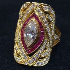 Luxury Marquise Ruby Ring With Diamonds, Luxury Marquise Ruby Ring, Luxury Red Marquise Ruby Ring, Luxury Marquise Red Ruby Ring, Luxury Marquise Multi-stone Diamond Ring, Luxury Ruby Diamond Ring With Rose Cut Diamonds, Luxury Ruby Marquise Cut Rings, Luxury Marquise Cut Multi-stone Diamond Ring, Luxury Multi-stone Marquise Cut Diamond Ring