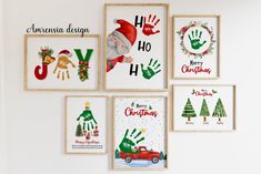 four christmas cards hanging on the wall with santa's handprints