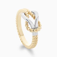 In a world of overcomplicated jewelry pieces, the Twisted Gold Knot Ring offers an air of effortless sophistication. High-end recycled gold is twisted artfully by Ecksand's masterful craftspeople to create an irresistible, eye-catching piece. Knot Rings, Reef Knot, Gold Knot Ring, Twist Knot, Knot Ring, Recycled Gold, In A World, Jewelry Pieces, Two Tone