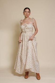 Brand: In Loom Floral print maxi dress with tie straps and side pockets. ♡ Details Color: Vintage Cream Tie straps Lightly smocked bodice Side pockets Partially lined 97% Cotton, 3% Polyester | Lining: 100% Rayon Hand wash recommended Size & Fit Model info: Height 5'3"| Bust 32"| Waist 25"| Hips 34" Model is wearing a size small Fit: Relaxed fit Stretch: Bodice of dress has stretch Measurements: S: Bust 31" | Length 51.5" M: Bust 33" | Length 52" L: Bust 35" | Length 53" Brunch Maxi Dress With Square Neck And Adjustable Straps, Maxi Sundress With Adjustable Straps For Daywear, Square Neck Maxi Dress With Adjustable Straps For Brunch, Beach Maxi Dress With Tie Straps And Square Neck, Vacation Maxi Dress With Adjustable Straps And Square Neck, Casual Maxi Dress With Adjustable Straps And Square Neck, Garden Party Cotton Maxi Dress With Smocked Bodice, Sundress Maxi Dress With Tie Straps For Daywear, Square Neck Maxi Dress With Smocked Back For Daywear